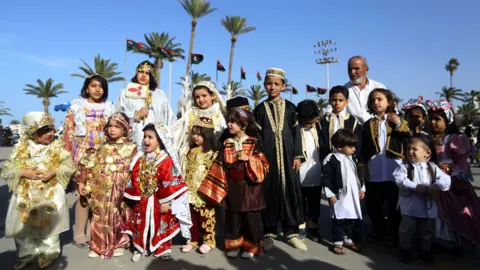 AFP Libyans dressed in their country"s traditional clothing attend the national day of the Libyan costume at the Martyrs Square in the capital Tripoli, on March 13, 2018