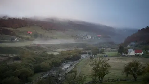 BBC/Derrick Evans Misty valley landscape with a few houses