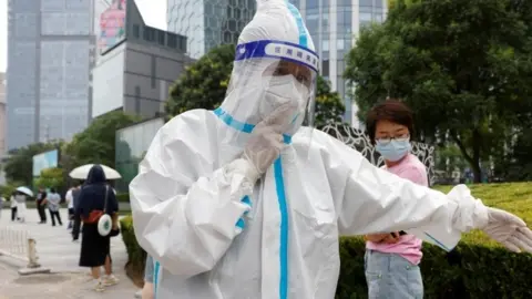 Reuters People queue to get tested in Beijing on Friday