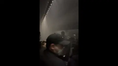 Passengers inside smoke filled cabin