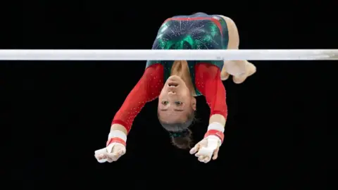 Tim Clayton/Getty Images Kaylia Nemour of Algeria performs on the uneven bars during Women's Qualification at the Artistic Gymnastics World Championships-Antwerp 2023 at the Antwerp Sportpaleis on October 2nd, 2023.