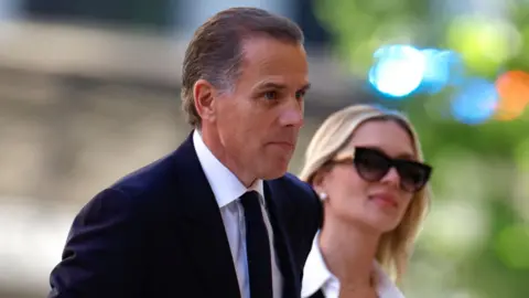 Getty Images Hunter and Melissa Cohen Biden enter the courtroom in Delaware