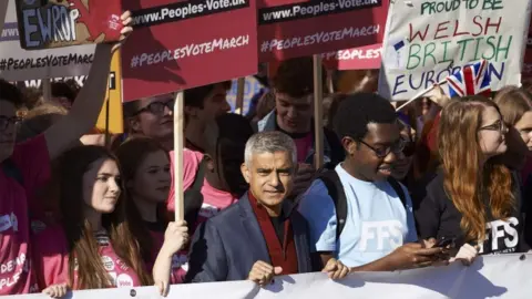 AFP London Mayor Sadiq Khan and demonstrators