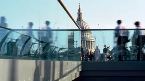 Getty Images City workers on millennium bridge