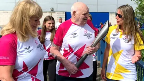 BBC John Osborne carrying the baton