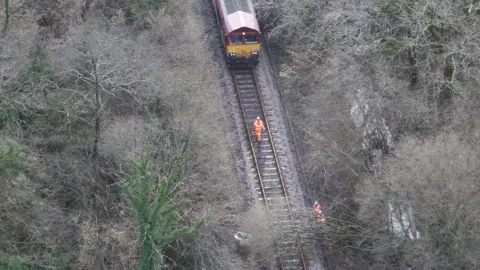 Network Rail Air Operations Aerial view of engineers clearing a fallen tree from the tracks near Llangadog, Carmarthenshire