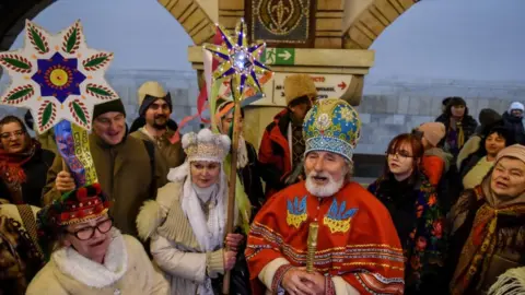 EPA-EFE/REX/Shutterstock People sing Christmas carols in Kyiv's underground, Ukraine. Photo: 25 December 2022