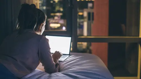 Getty Images A woman on a laptop