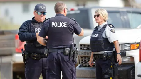 Reuters Canadian police at the scene in James Smith Cree Nation