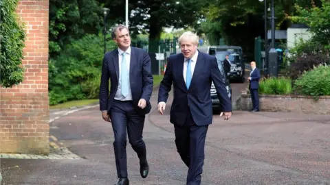 NIO NI Secretary Julian Smith with Prime Minister Boris Johnson as he arrived at Stormont