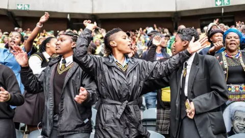 AFP South African students joined mourners at the Olando Stadium in Soweto, outside Johannesburg, on 11 April 2018