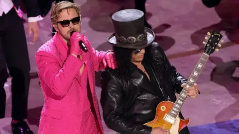 Getty Images Ryan Gosling and Slash at The Oscars