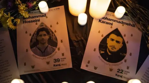 Getty Images A memorial for Seyed Mohammad Hosseini and Mohammad Mehdi Karami set up during a protest outside the US home of Iran's ambassador to the UN in New York, 16 November 2023