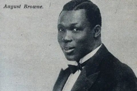 Public Domain Agboola Browne in a suit