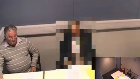 West Midlands Police Neil Harris being interviewed by police