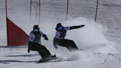 Getty Images Ellie Soutter pictured in action in the snowboard cross at the European Youth Olympics Winter Festival in 2017