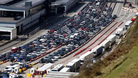 Reuters Vehicles wait to check-in ahead of departure on ferries at the Port of Dover in Dover on Friday 7 April 2023