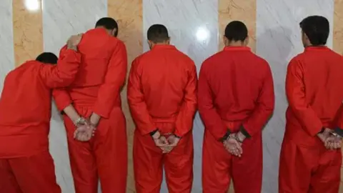 Iraq's justice ministry Picture from behind of five of those condemned