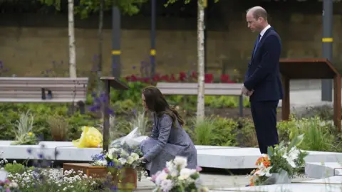 PA Media The Duke and Duchess of Cambridge lay flowers as they attend the official opening of the Glade of Light Memorial