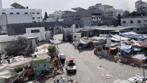 Reuters Tents and shelters used by displaced Palestinians in the yard of Al-Shifa hospital