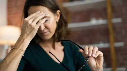 Getty Images Woman who feels tired