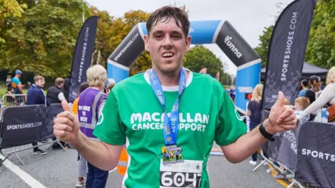 Macmillan Cancer Support Nathan West with his medal