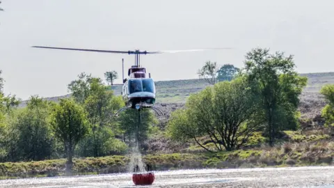 Pennine Helicopters Helicopter picking up water