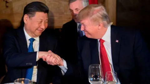 Getty Images US President Donald Trump (R) and Chinese President Xi Jinping (L) shake hands during dinner at the Mar-a-Lago estate in West Palm Beach, Florida, on April 6, 2017