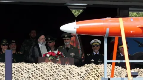 EPA Iranian President Ebrahim Raisi at a military base in Tehran