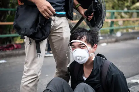 Getty Images HONG KONG, CHINA - NOVEMBER 18: Police arrest anti-government protesters at Hong Kong Polytechnic University on November 18, 2019 in Hong Kong, China. Anti-government protesters armed with bricks, firebombs, and bows and arrows fought with the police at university campuses over the weekend as demonstrations in Hong Kong stretched into its sixth month with demands for an independent inquiry into police brutality, the retraction of the word "riot" to describe the rallies, and genuine universal suffrage. (Photo by Laurel Chor/Getty Images)