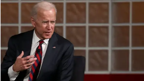 Win McNamee Biden speaking at a university