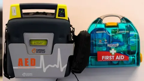 PA Media Defibrillator and first aid kit at a gym