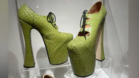 Bright green Vivienne Westwood elevated shoes with deep soles, Northampton Gallery