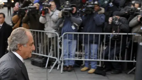 AFP Disgraced Wall Street financier Bernard Madoff (L) arrives at a US Federal Court on March 12, 2009 in New York