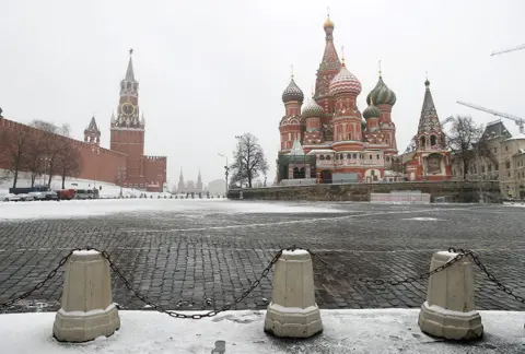 Maxim Shemetov / Reuters The clock on Spasskaya tower showing the time at noon, is pictured next to Moscow's Kremlin, and St. Basil's Cathedral