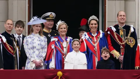 Owen Humphreys / PA Media The Royal Family watches the flypast on the balcony