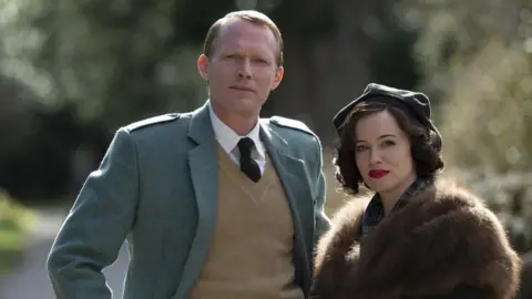 BBC / Blueprint Productions A picture of Paul Bettany and Claire Foy in A Very British Scandal