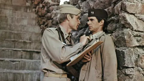 Getty Images Catch-22 was made into a film in 1970, starring Jon Voight and Anthony Perkins, and directed by Mike Nichols