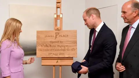 PA Clare Milford Haven (left) looks-on as The Duke of Cambridge unveils a plaque during a visit to James" Place in Liverpool