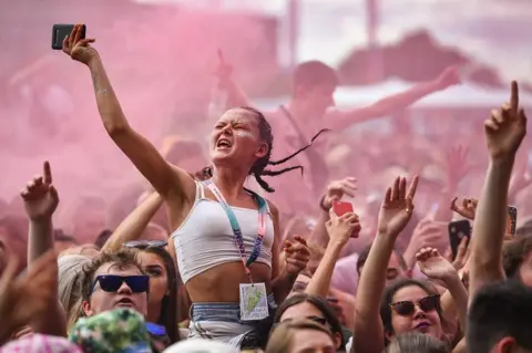 Getty Images Fans watch The Kooks perform on the main stage