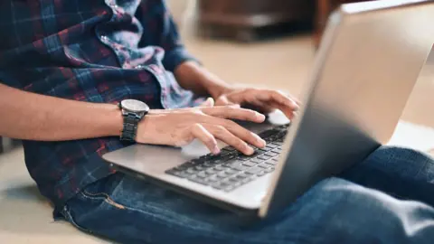 Getty Images man using laptop