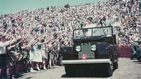 Getty Images Queen Elizabeth II and Prince Philip wave to the crowd on their visit to Australia in 1954