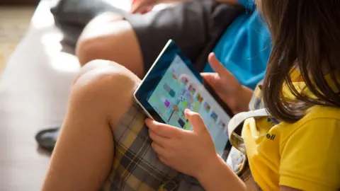 Getty Images Child with tablet