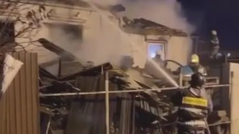 Firefighters at the scene in Irkutsk