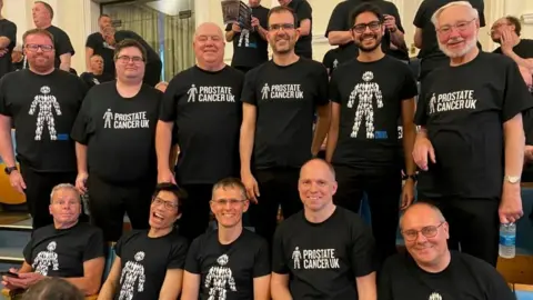 Peterborough Sings choir in Prostate Cancer UK shirts