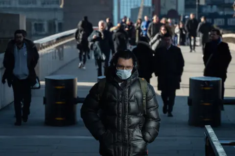 Getty Images Commuters on London Bridge
