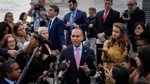 Getty Images House Minority Leader Hakeem Jeffries speaks to reporters on the East Steps of the U.S. Capitol on October 17, 2023