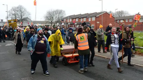 Getty Images The pyramid's foundation stone was transported through the streets of Toxteth