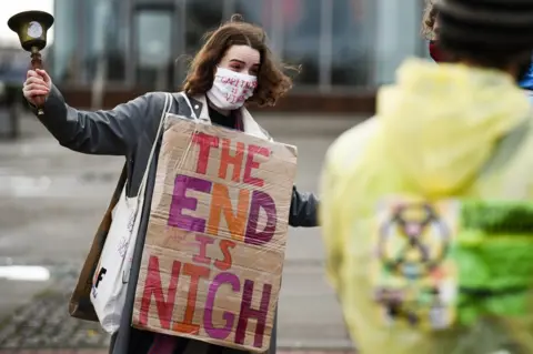 Getty Images Climate activist near the COP26 conference venue in 2021