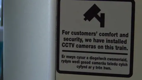 CCTV notice on train
